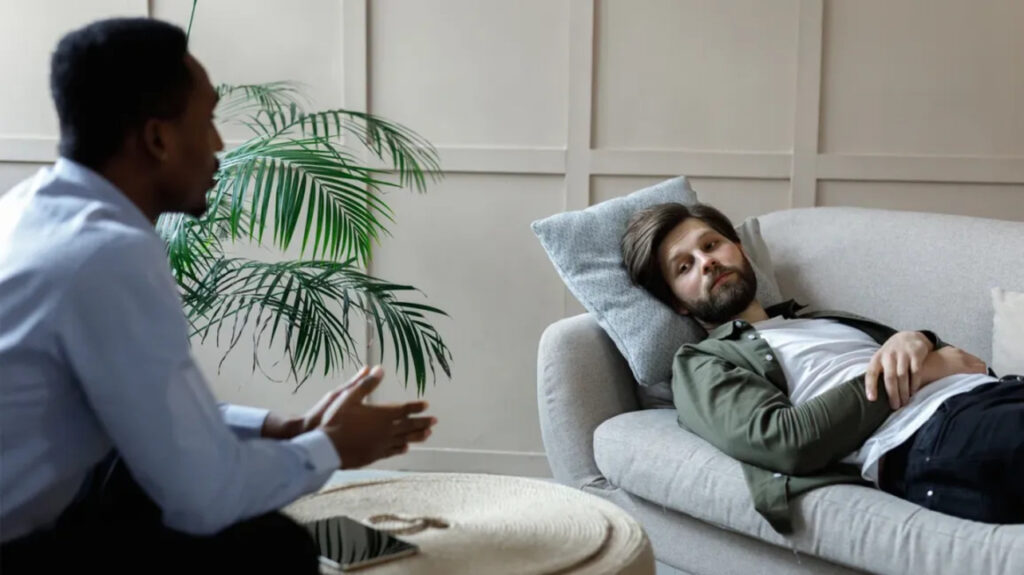 Ilustramos um homem passando em atendimento psicológico para tratamento de depressão